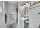 Compact bathroom offering a shower, vanity with sink, modern lighting, and stylish tile accents at 6368 S Harlan Way, Littleton, CO 80123