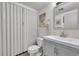 Bathroom featuring a modern vanity with a clean, stylish design, toilet, and updated shower at 6368 S Harlan Way, Littleton, CO 80123