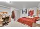 Bedroom features neutral carpet, a double closet, and natural light at 6368 S Harlan Way, Littleton, CO 80123