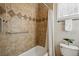 Bathroom featuring decorative tile, a shower/tub, and neutral walls at 10103 Bluffmont Ln, Lone Tree, CO 80124