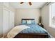 Bedroom showcasing a wooden bed frame, neutral walls, and a ceiling fan at 10103 Bluffmont Ln, Lone Tree, CO 80124