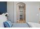 Bedroom with a view of the ensuite bathroom and walk-in closet at 10103 Bluffmont Ln, Lone Tree, CO 80124
