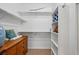 Walk-in closet featuring built-in shelving and drawers, offering ample storage space at 10103 Bluffmont Ln, Lone Tree, CO 80124