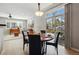 Open concept living space with a dining area that boasts a sliding glass door for great natural light at 10103 Bluffmont Ln, Lone Tree, CO 80124