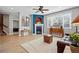 Inviting living room with hardwood floors, a cozy fireplace, and stylish decor at 10103 Bluffmont Ln, Lone Tree, CO 80124