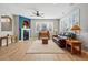 Cozy living room with a fireplace, large windows, hardwood floors, and stylish furnishings at 10103 Bluffmont Ln, Lone Tree, CO 80124