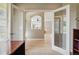 Home office showcases a view into a living space through double french doors for an open feel at 10103 Bluffmont Ln, Lone Tree, CO 80124