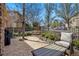 Cozy patio with stone pavers, outdoor seating, and privacy fencing and landscaping at 10103 Bluffmont Ln, Lone Tree, CO 80124