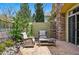 Cozy patio area with comfortable seating and a small table, perfect for outdoor relaxation and entertaining at 10103 Bluffmont Ln, Lone Tree, CO 80124