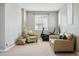 Relaxing living area with two chairs, exercise bike, and a neutral color palette at 10103 Bluffmont Ln, Lone Tree, CO 80124