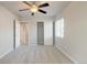 Cozy bedroom featuring neutral paint, ceiling fan and adjacent closet at 3355 Willowrun Dr, Castle Rock, CO 80109