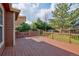 Spacious wooden deck overlooking the lush, fenced backyard, great for outdoor living at 3355 Willowrun Dr, Castle Rock, CO 80109