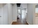 Inviting entryway leads to a spacious living area with hardwood floors and sliding glass doors to the backyard at 3355 Willowrun Dr, Castle Rock, CO 80109