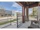 Enjoy a serene view from this porch overlooking neighborhood shops and green spaces at 7010 W Alaska Dr, Lakewood, CO 80226