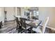 Inviting dining room with wood floors, a stylish table, and six chairs for comfortable seating and Gathering gatherings at 7010 W Alaska Dr, Lakewood, CO 80226