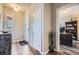 Inviting entryway with hardwood floors, leading to a bright office and providing a warm welcome at 7010 W Alaska Dr, Lakewood, CO 80226