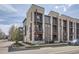 Contemporary townhome featuring modern architecture, private balconies, and attractive curb appeal in a desirable urban location at 7010 W Alaska Dr, Lakewood, CO 80226