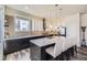 Modern kitchen boasting granite countertops, a breakfast bar island, stainless steel appliances, and sleek cabinets at 7010 W Alaska Dr, Lakewood, CO 80226