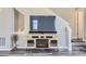 Cozy living room with a modern entertainment unit, perfect for relaxation and entertainment at 7010 W Alaska Dr, Lakewood, CO 80226