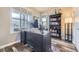 Functional office space with a large desk, custom shelving, and bright windows for a productive work environment at 7010 W Alaska Dr, Lakewood, CO 80226