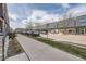 Street view of the property showcasing nearby businesses at 7010 W Alaska Dr, Lakewood, CO 80226