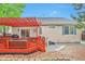 Charming backyard deck with stylish pergola, accessible from the house at 18619 E Vassar Dr, Aurora, CO 80013