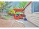 Well-maintained backyard with a deck and pergola, ideal for outdoor living at 18619 E Vassar Dr, Aurora, CO 80013