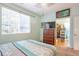 Comfortable bedroom featuring a large window and walk in closet at 18619 E Vassar Dr, Aurora, CO 80013