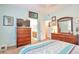 Bedroom includes large television, and ensuite bathroom at 18619 E Vassar Dr, Aurora, CO 80013