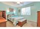 Cozy bedroom with a ceiling fan, large window, and comfortable furnishings at 18619 E Vassar Dr, Aurora, CO 80013