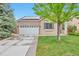 Charming single-Gathering home features a two-car garage, solar panels, and well-maintained lawn at 18619 E Vassar Dr, Aurora, CO 80013