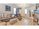 Bright, inviting living area boasts a cozy seating arrangement, and glass paneled french doors at 18619 E Vassar Dr, Aurora, CO 80013