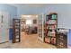 Bright room with an open door to the living room, plenty of storage and a neutral color scheme at 18619 E Vassar Dr, Aurora, CO 80013