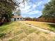 This backyard has a new wooden fence, green grass and a sidewalk leading to the back of the house at 2895 Poplar St, Denver, CO 80207