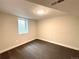 Cozy finished basement with carpet, a small window, and a flush mount ceiling light at 2895 Poplar St, Denver, CO 80207