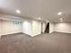 This is a spacious finished basement with carpet, recessed lighting, and access to stairs at 2895 Poplar St, Denver, CO 80207