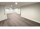 Finished basement featuring neutral walls, carpet, and recessed lighting and access to another room at 2895 Poplar St, Denver, CO 80207