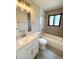 Bathroom featuring updated vanity, bathtub, shower and modern fixtures at 2895 Poplar St, Denver, CO 80207