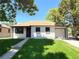 Charming single-story home with a well-manicured lawn, attached garage, and appealing neutral exterior paint at 2895 Poplar St, Denver, CO 80207