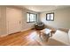 Bright living room with hardwood floors, neutral walls, and comfortable seating arrangement at 2895 Poplar St, Denver, CO 80207