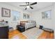 Bedroom featuring hardwood floors, a ceiling fan, and natural light at 6755 W 33Rd Ave, Wheat Ridge, CO 80033