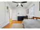 Bedroom featuring hardwood floors, a ceiling fan, and a dresser at 6755 W 33Rd Ave, Wheat Ridge, CO 80033