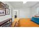 Comfortable bedroom featuring hardwood floors, a ceiling fan, and a closet at 6755 W 33Rd Ave, Wheat Ridge, CO 80033
