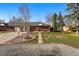 Charming brick home featuring a manicured front yard and inviting walkway at 6755 W 33Rd Ave, Wheat Ridge, CO 80033