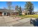 Charming single-Gathering home featuring a manicured lawn and mature trees at 6755 W 33Rd Ave, Wheat Ridge, CO 80033