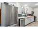 Bright kitchen has stainless steel appliances, including a dishwasher at 6755 W 33Rd Ave, Wheat Ridge, CO 80033