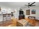 Open-concept living room with hardwood floors, breakfast bar, and stylish decor at 6755 W 33Rd Ave, Wheat Ridge, CO 80033