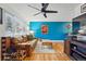 Comfortable living space featuring hardwood floors, ceiling fan, and natural light at 6755 W 33Rd Ave, Wheat Ridge, CO 80033