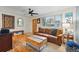 Bright living room with hardwood floors, a wooden bench, and a rustic coffee table at 6755 W 33Rd Ave, Wheat Ridge, CO 80033