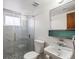 Clean bathroom with a glass shower door and marble tile at 2169 E 116Th Ave, Northglenn, CO 80233